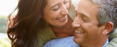 Man and woman looking at each other and smiling