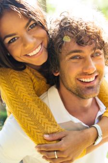 Man giving woman a piggyback ride