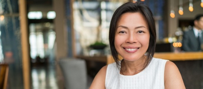 Smiling woman in a white sweater