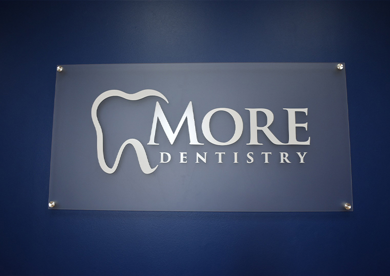 More Dentistry logo mounted on wall